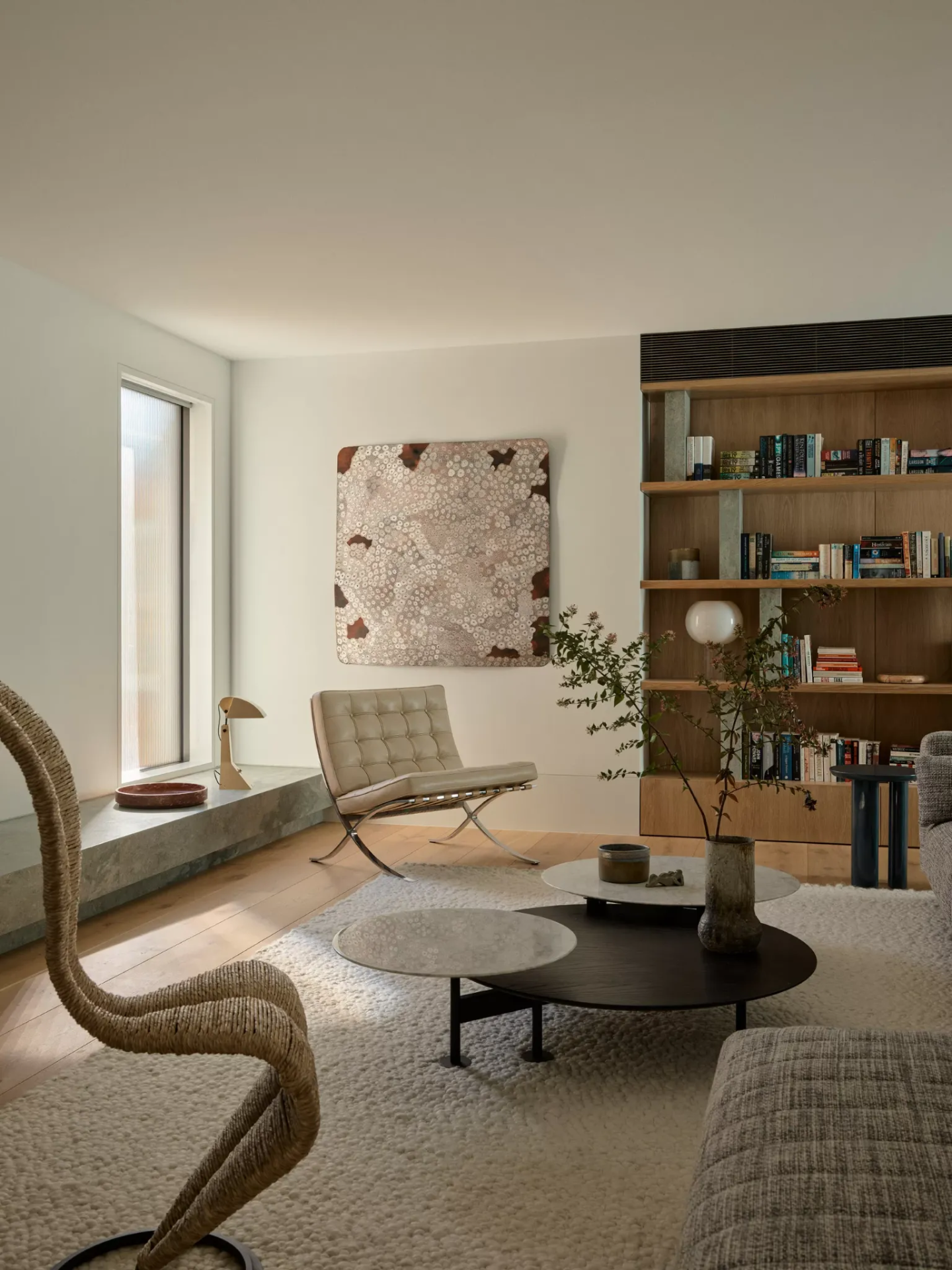 Library sitting room with oak shelving, stone ledge and integrated air conditioning