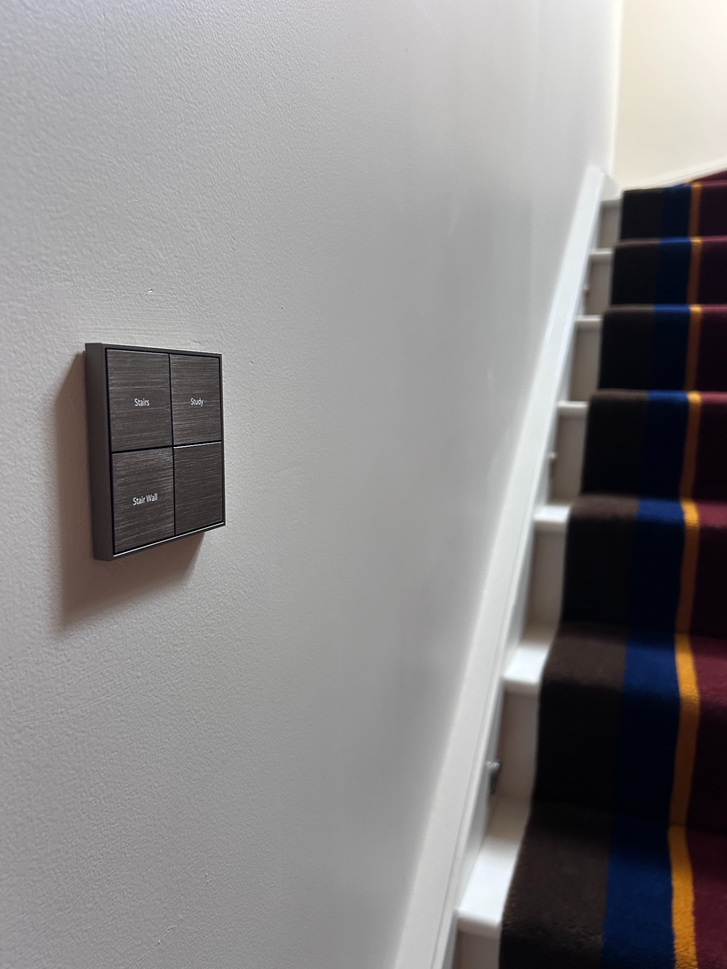 Engraved keypad on a stair wall labelled Stairs, Study and Stair Wall