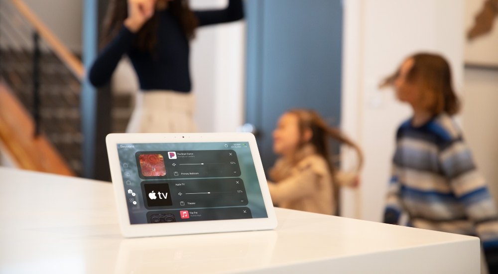 Control4 T5 tabletop touchscreen on a kitchen island in a family home