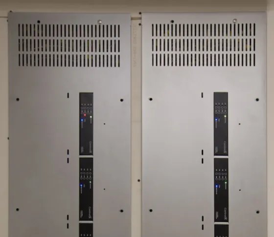 Control4 centralised lighting panels installed in a services cupboard